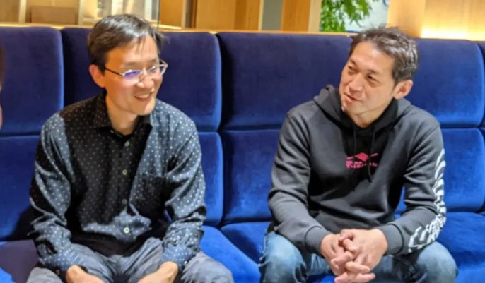 Team members talking at the FINOLAB office in Otemachi
